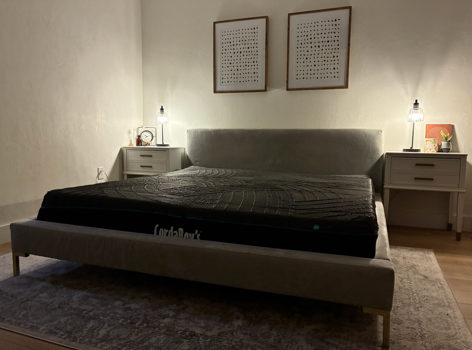 A cordaroys hybrid mattress between two night stands in a bedroom. 
