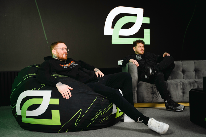 OpTic Gaming Bean Bag chair with two OpTic gaming players sitting. 