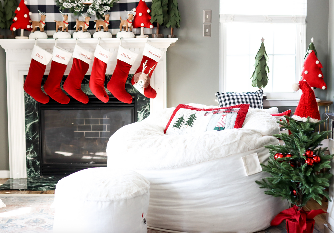 A cordaroys bean bag and footstool are decorated for the holidays.