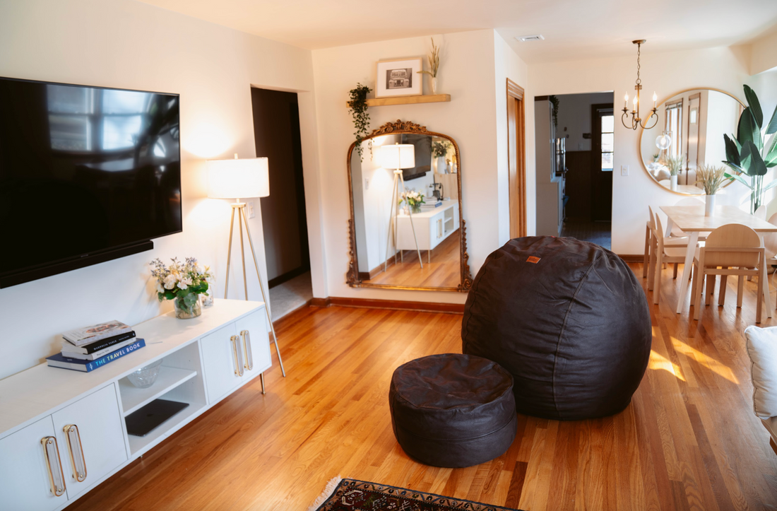 A cordaroys bean bag in a living room being used also as a dining room