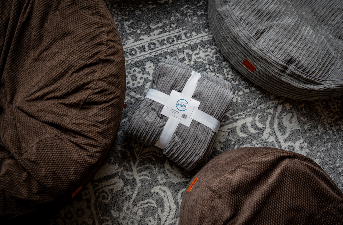 Various cordaroys products on a living room carpet showcasing the various textures. 