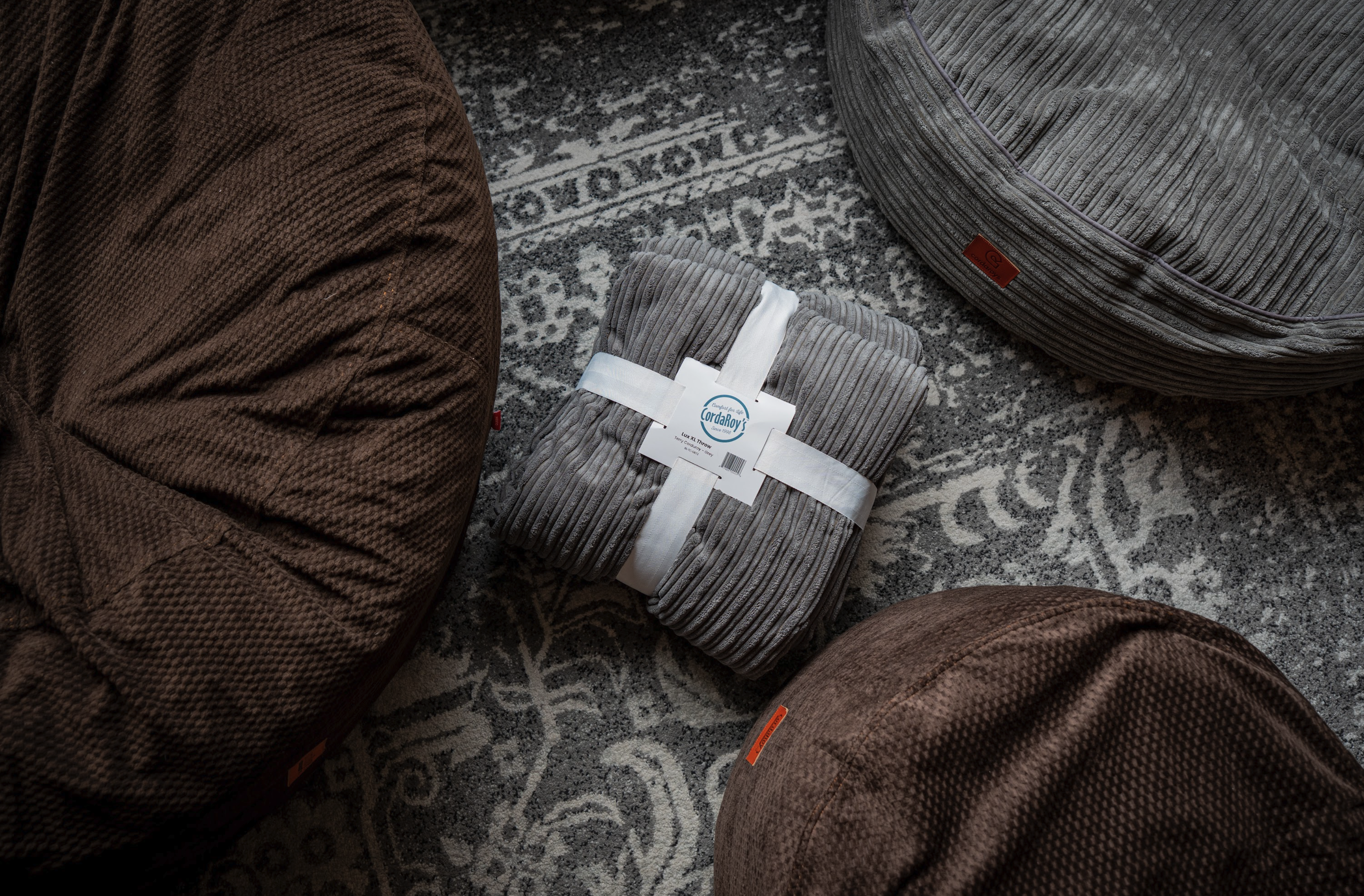 Various cordaroys products on a living room carpet showcasing the various textures. 