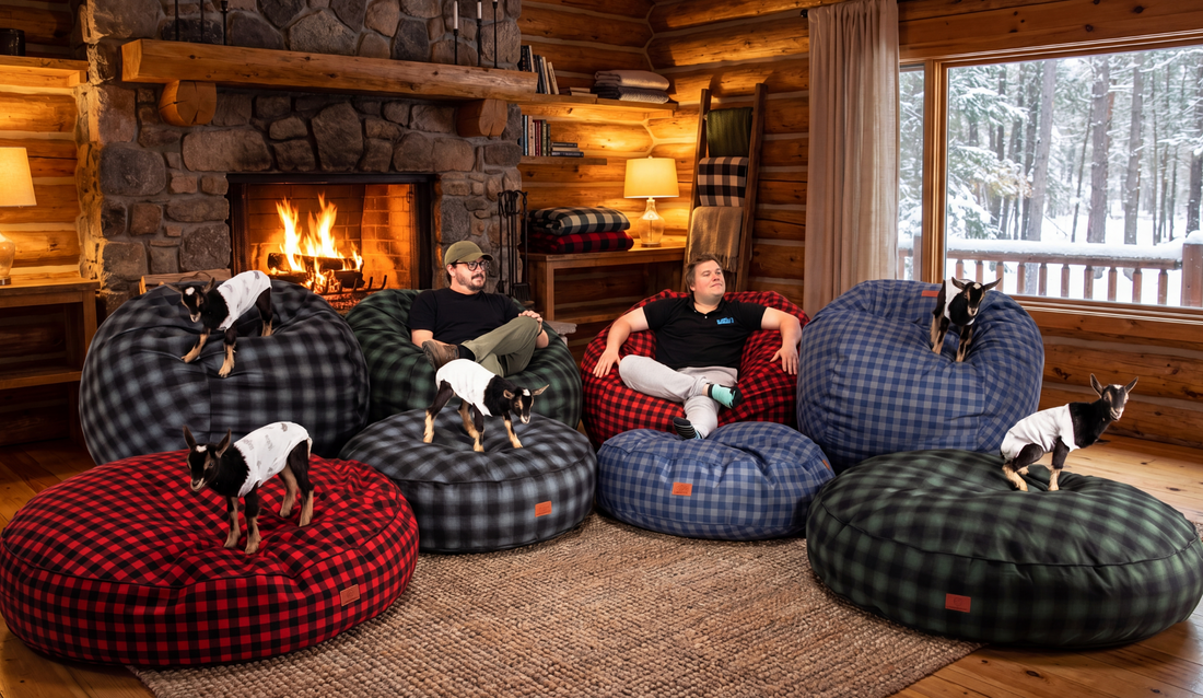 Two men sit on cordaroys bean bag in a cozy, cabin.
