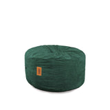A round Corduroy Pouf Footstool in a solid green color with visible stitching and a brand label attached to it.