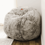 Cordaroys bean bag chair with chinchilla fabric in the corner of a room