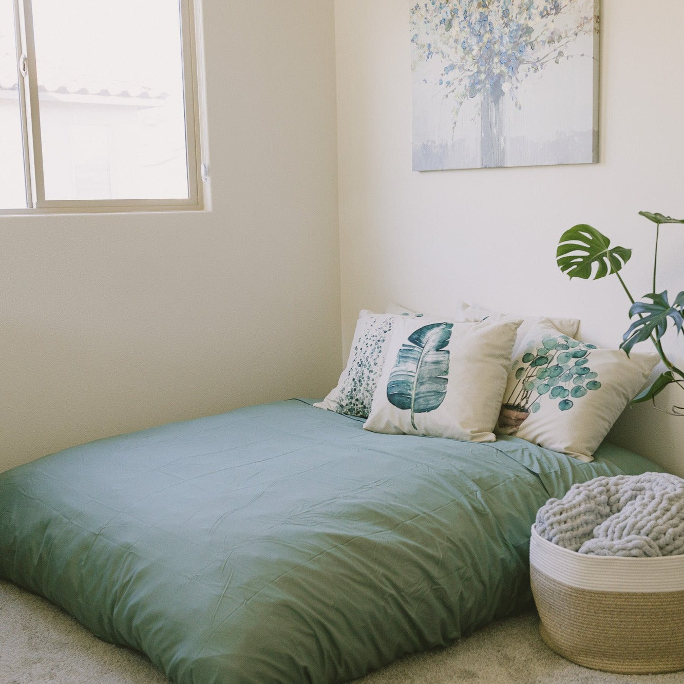 A cordaroys full bean bag chair is set up in bed mode in a bedroom. 