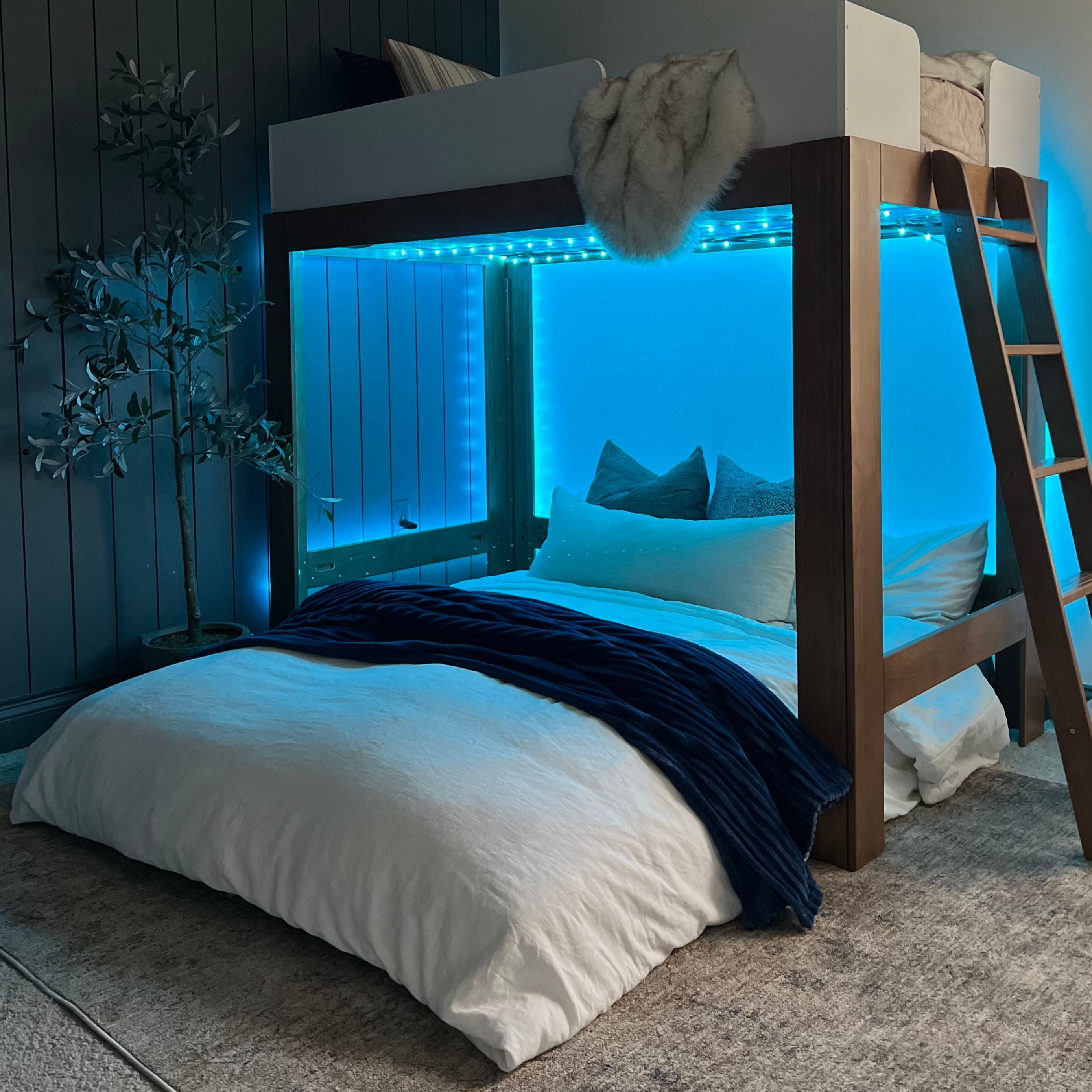 A cordaroys full bean bag is in bed form under a bunk bed. 