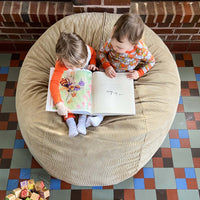 Two kids sit of a full cordaroys bean bag in kahka corduroy. 