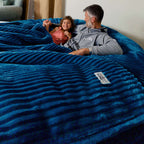 A dad and his daughter relax in a giant plush corduroy bean bag by cordaroys. 