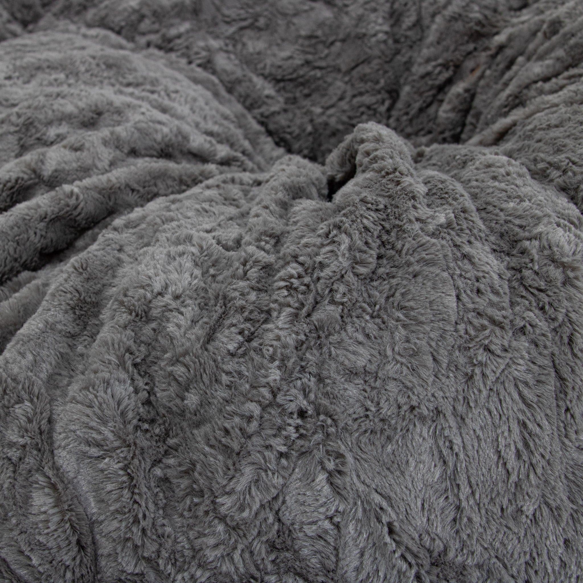 A close-up of cordaroys faux fur gray cover for their pillow lounger.