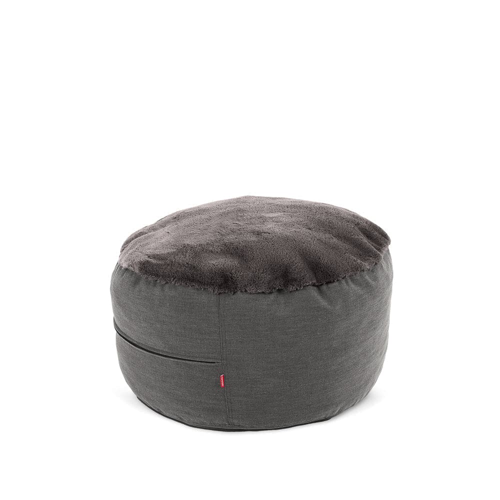 A cordaroys NEST foostool in charcoal bunny fur. 