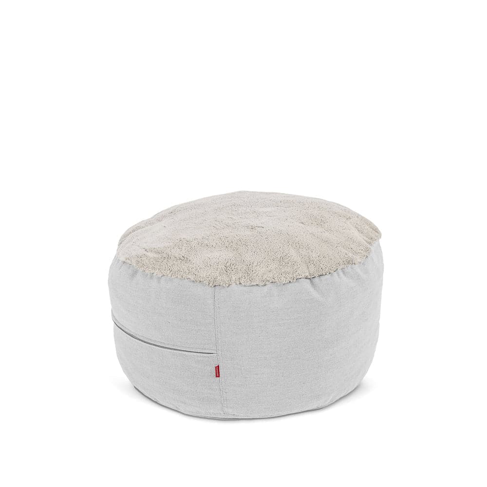 Nest Footstool in cream bunny fur.